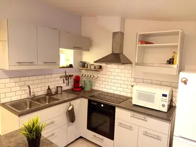 Cuisine ou kitchenette dans l'établissement Escale - Maison - Nantes aéroport