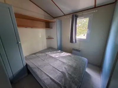 Un ou plusieurs lits dans un hébergement de l'établissement Camping L'AMBOIS