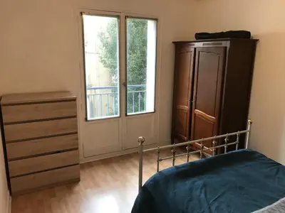 Un ou plusieurs lits dans un hébergement de l'établissement Appartement proche Quai de la Fosse