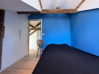 Un ou plusieurs lits dans un hébergement de l'établissement Le Triplex du Quai