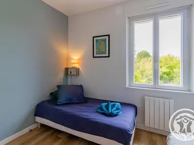 Un ou plusieurs lits dans un hébergement de l'établissement Maison rénovée avec jardin proche d'Angers - FR-1-622-92