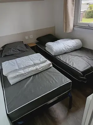 Un ou plusieurs lits dans un hébergement de l'établissement MH F52 Camping Bois Masson