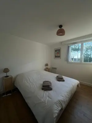 Un ou plusieurs lits dans un hébergement de l'établissement Appartement d'Exception à 20m de la Plage Votre Évasion Parfaite