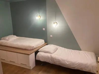 Un ou plusieurs lits dans un hébergement de l'établissement Appartement d'Exception à 20m de la Plage Votre Évasion Parfaite