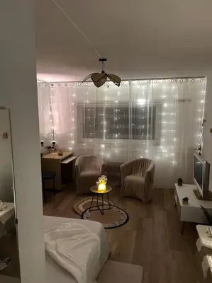 Coin salon dans l'établissement Appartement Relaxe