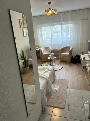 Coin salon dans l'établissement Appartement Relaxe