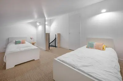 Un ou plusieurs lits dans un hébergement de l'établissement À 400m de la plage, maison renovée pour 6