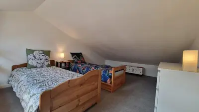 Un ou plusieurs lits dans un hébergement de l'établissement Jolie maison 5 minutes de l ocean