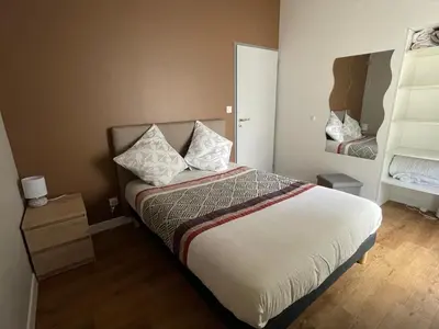 Un ou plusieurs lits dans un hébergement de l'établissement Gîte de 4 chambres - Ancenis A11 - Logis du Château Rouge