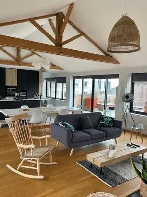 Coin salon dans l'établissement Appartement loft avec terrasse