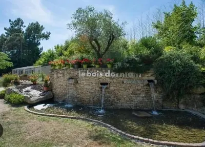 Jardin de l'établissement Mobil-home bww camping le bois dormant