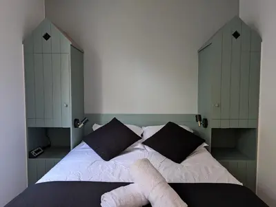 Un ou plusieurs lits dans un hébergement de l'établissement Ker Maretz Appartement lumineux entre côte et parc
