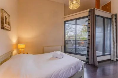 Un ou plusieurs lits dans un hébergement de l'établissement La Capitainerie - Maison 6p avec grande terrasse