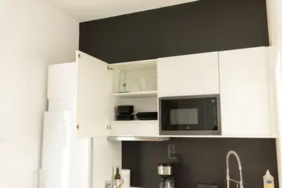 Cuisine ou kitchenette dans l'établissement L'Exotique - Hypercentre - Gare