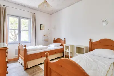 Un ou plusieurs lits dans un hébergement de l'établissement Maison pour 6, à proximité du centre ville