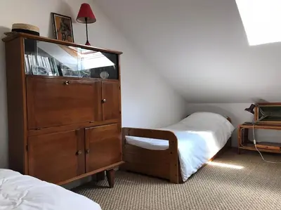 Un ou plusieurs lits dans un hébergement de l'établissement Petite maison cosy