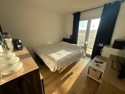 Un ou plusieurs lits dans un hébergement de l'établissement Plage Bleue, terrasse vue mer, wifi Netflix