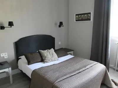 Un ou plusieurs lits dans un hébergement de l'établissement Hôtel Restaurant les Voyageurs