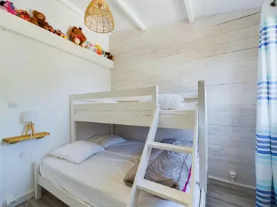Un ou plusieurs lits dans un hébergement de l'établissement À 550m de la plage, jolie maison pour 5
