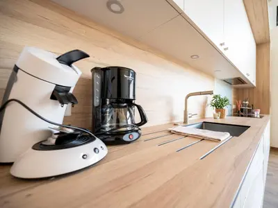 Cuisine ou kitchenette dans l'établissement Gîte L'Art du Rustique Chic - Sérénité et Elégance