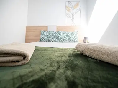 Un ou plusieurs lits dans un hébergement de l'établissement Gîte L'Art du Rustique Chic - Sérénité et Elégance