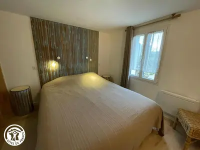 Un ou plusieurs lits dans un hébergement de l'établissement Maison moderne avec clim, jardin et parking, proche plage Noirmoutier - FR-1-426-565