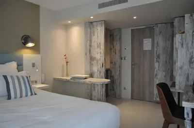 Un ou plusieurs lits dans un hébergement de l'établissement Les 3 Lieux - Hôtel, Restaurant, Espace sensoriel