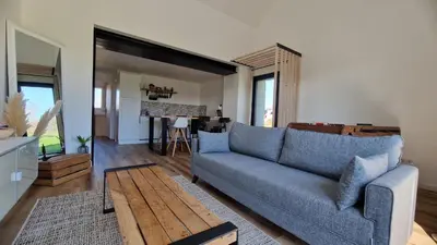 Coin salon dans l'établissement Maison 2-6 Personnes