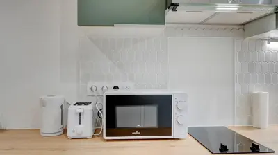 Cuisine ou kitchenette dans l'établissement Le Brière - Appart'Escale
