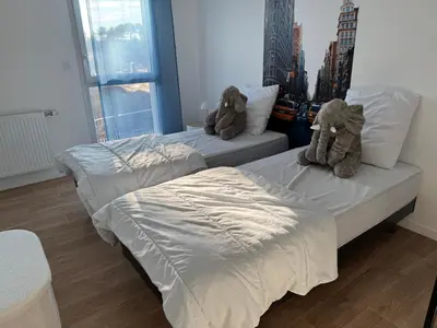 Un ou plusieurs lits dans un hébergement de l'établissement Casa Nomana 4 chambres