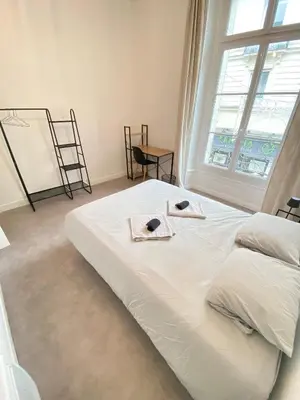 Un ou plusieurs lits dans un hébergement de l'établissement L'Appartement Privilège - 4 chambres - Coeur d'Angers, Spacieux et Élégant