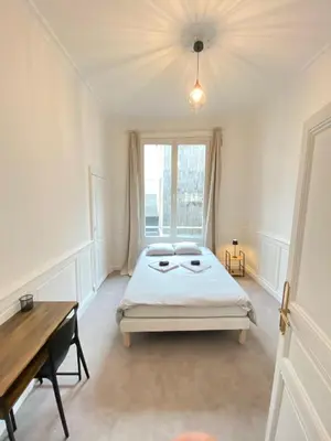 Un ou plusieurs lits dans un hébergement de l'établissement L'Appartement Privilège - 4 chambres - Coeur d'Angers, Spacieux et Élégant