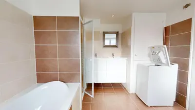 Salle de bains dans l'établissement Le Chant des Vagues