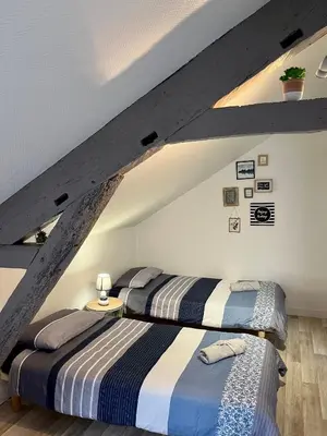 Un ou plusieurs lits dans un hébergement de l'établissement Casa Cocon -Charmant T3-plages, centre ville- 4 personnes