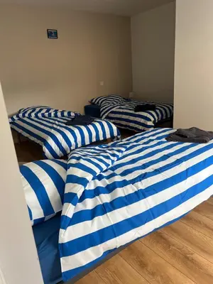 Un ou plusieurs lits dans un hébergement de l'établissement Appartement des dauphins