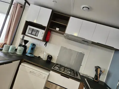 Cuisine ou kitchenette dans l'établissement Chez Sandy et Romain