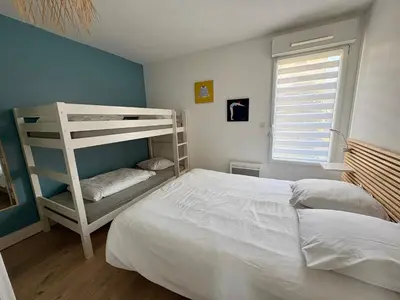 Un ou plusieurs lits dans un hébergement de l'établissement Charmant T2 direct plage