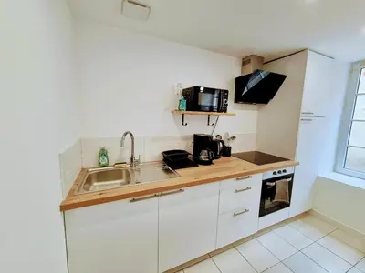 Cuisine ou kitchenette dans l'établissement Maison de Bourg St Amand 5pers 15min Puy du Fou