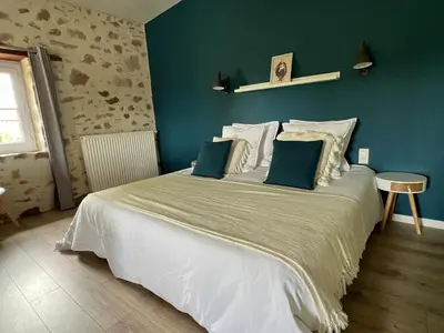 Un ou plusieurs lits dans un hébergement de l'établissement La Millière - Piscine & Campagne - Cathelineau