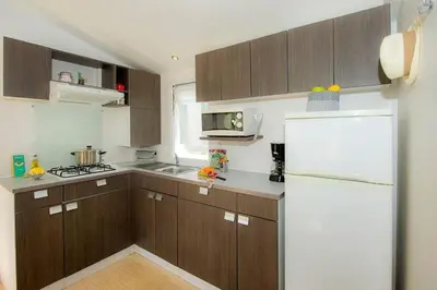 Cuisine ou kitchenette dans l'établissement Camping Cœur de Vendée