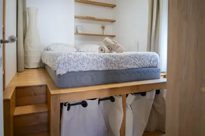 Un ou plusieurs lits dans un hébergement de l'établissement charmant appartement coeur de ville 4 personnes