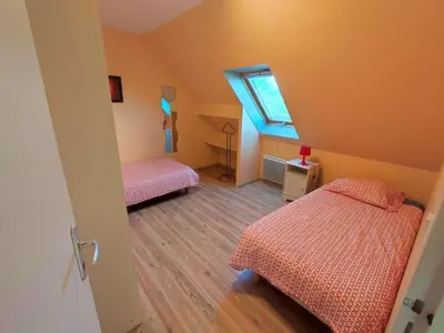 Un ou plusieurs lits dans un hébergement de l'établissement Gîte meublé 10 personnes