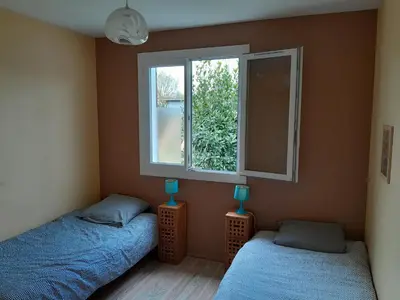 Un ou plusieurs lits dans un hébergement de l'établissement Gîte meublé 10 personnes
