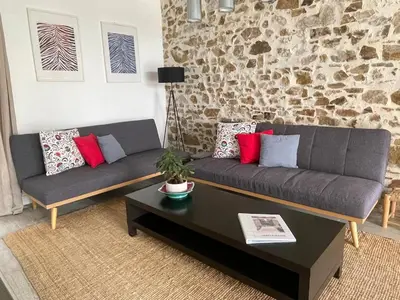 Coin salon dans l'établissement Demeure avec piscine