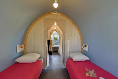 Un ou plusieurs lits dans un hébergement de l'établissement Camping l'Hermitage