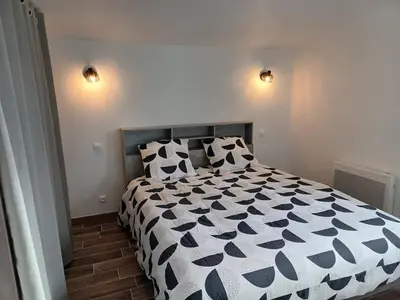 Un ou plusieurs lits dans un hébergement de l'établissement La maison du soleil