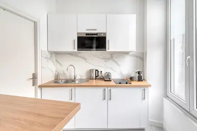 Cuisine ou kitchenette dans l'établissement Le Majorelle - Hypercentre - Quartier Apaisant