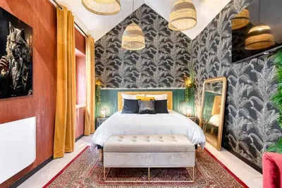 Un ou plusieurs lits dans un hébergement de l'établissement Suite avec jacuzzi - Le Boudoir de la Loire