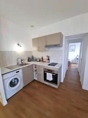 Cuisine ou kitchenette dans l'établissement Joli appartement à Paimboeuf