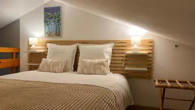 Un ou plusieurs lits dans un hébergement de l'établissement L'Atlantide Maison & Spa - Accès direct à la plage
